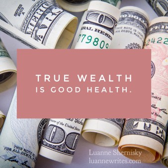 Image of rolled up currency with the message True wealth is good health