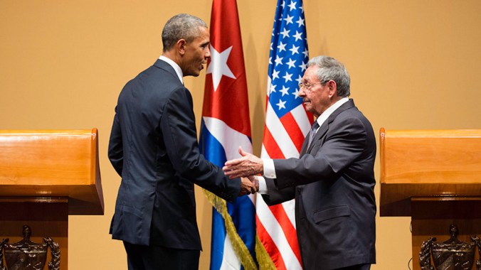 President Obama shaking hands with Raul Castro, president of Cuba.